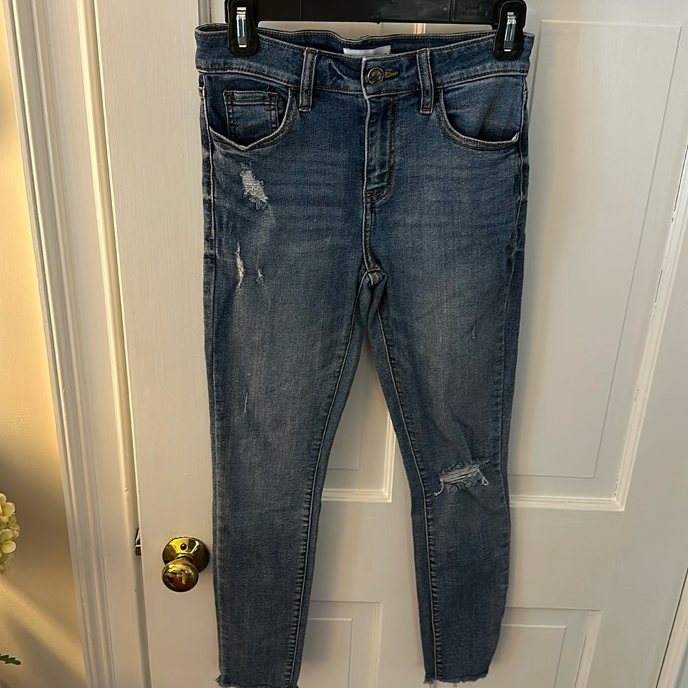 Studio blue distressed jeans.